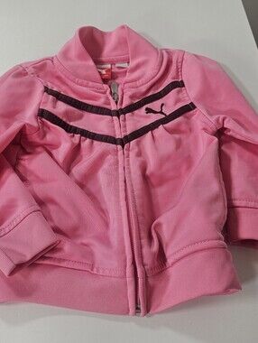 pink Puma girls zip-up track jacket with dark brown athletic stripes.